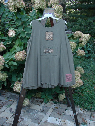 1995 Invention Smock The Garden Snail Bramble OSFA features front pleats, bib pocket, snail-themed paint, and rivet-accented side pockets, embodying vintage Blue Fish Clothing's creative individuality.