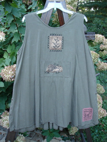 1995 Invention Smock The Garden Snail Bramble OSFA features pleats, front bib pocket, metal-riveted side pockets, whimsical snail design, and a wide A-line shape, embodying vintage Blue Fish creativity.