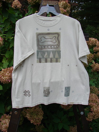 1995 Short Sleeved Crop Tee Doggie Bone Beach Glass Size 1: A white t-shirt with a design of a bone and triangles, perfect condition.