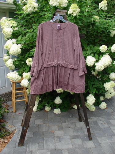 1998 Basket Weave Tencel Bi Level Top Border Band Elderberry Size 2: A purple shirt with pleated lowers and tiny shell-like buttons.
