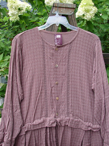 1998 Basket Weave Tencel Bi Level Top Border Band Elderberry Size 2: A purple shirt with pleated lowers, lace verticals, and shell-like buttons.