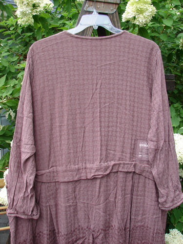 1998 Basket Weave Tencel Bi Level Top Border Band Elderberry Size 2: A purple shirt with lace verticals, pleated lowers, and a wide hemline.