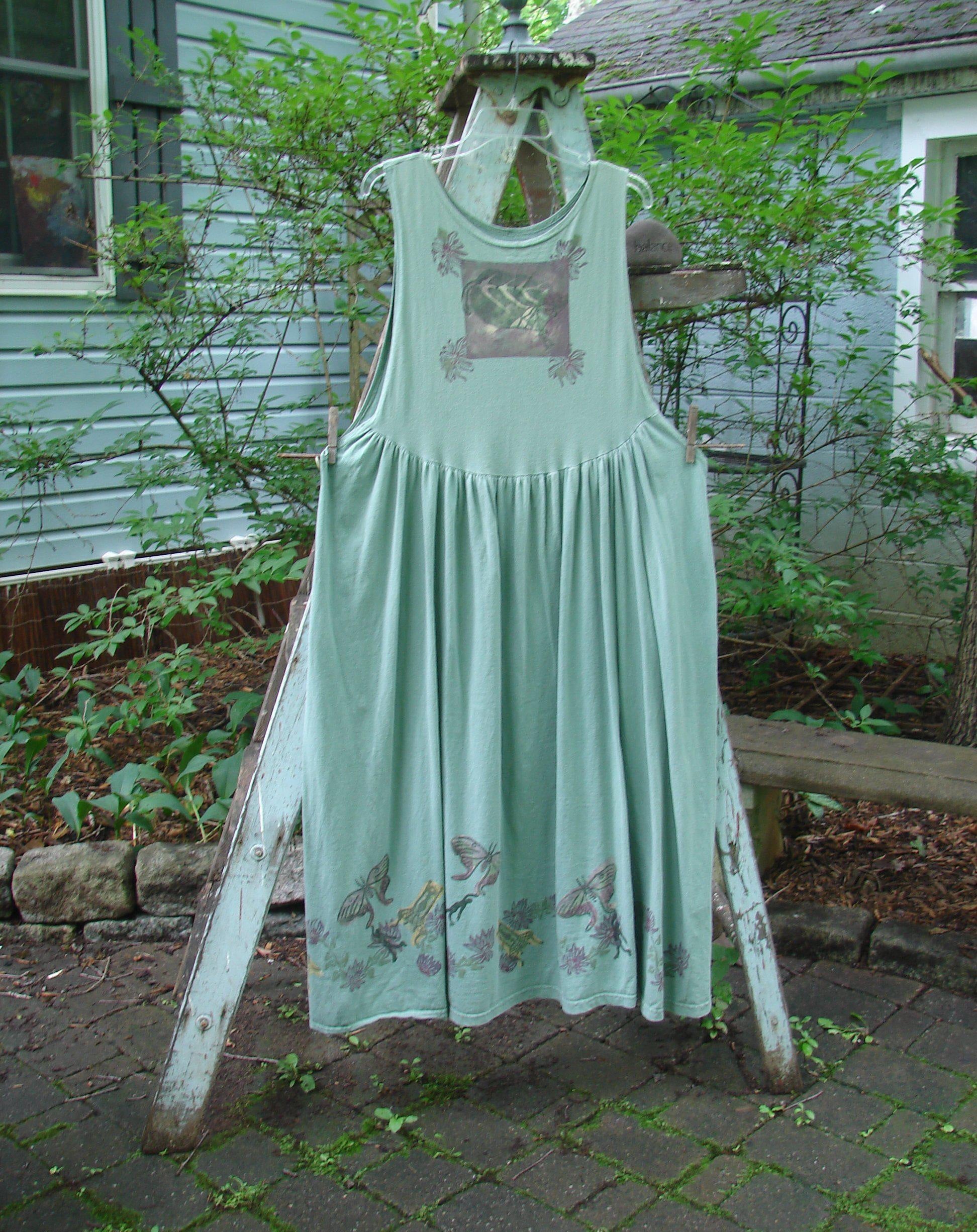 1994 Side Button Jumper Butterfly Garden River Size 1: A dress on a clothesline with a butterfly garden theme paint.