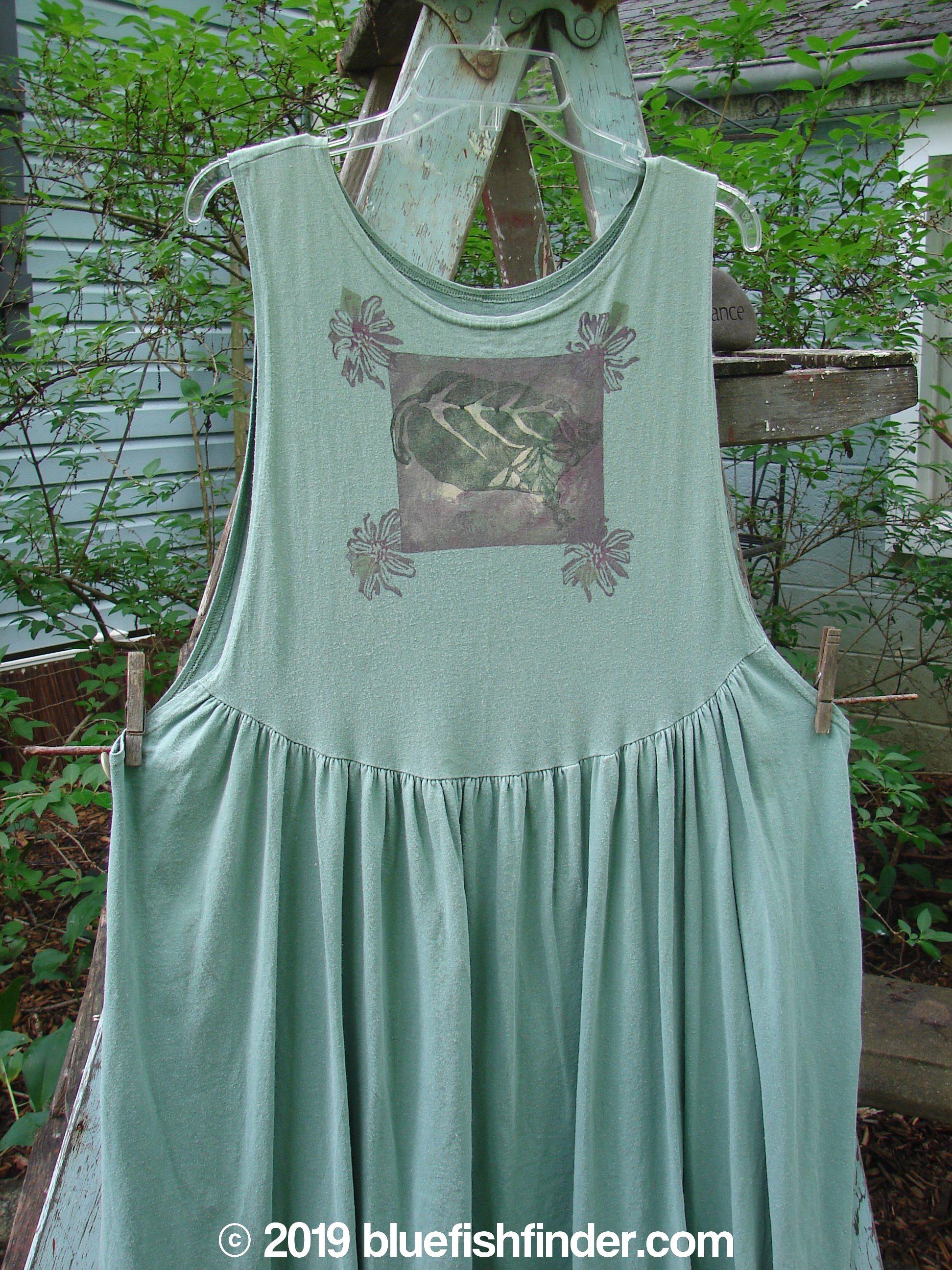 A 1994 Side Button Jumper Butterfly Garden River dress, size 1, in perfect condition. Features include a rounded neckline, deeper arm openings, narrowing bodice, and buttons at each side of the waist for attaching the missing front apron panel. The dress has an upward curved front and rear drop waist seam, gathered lower fabric, and butterfly garden theme paint. Bust: 15 and open, waist: 50, hips: 60, length: 52 inches.