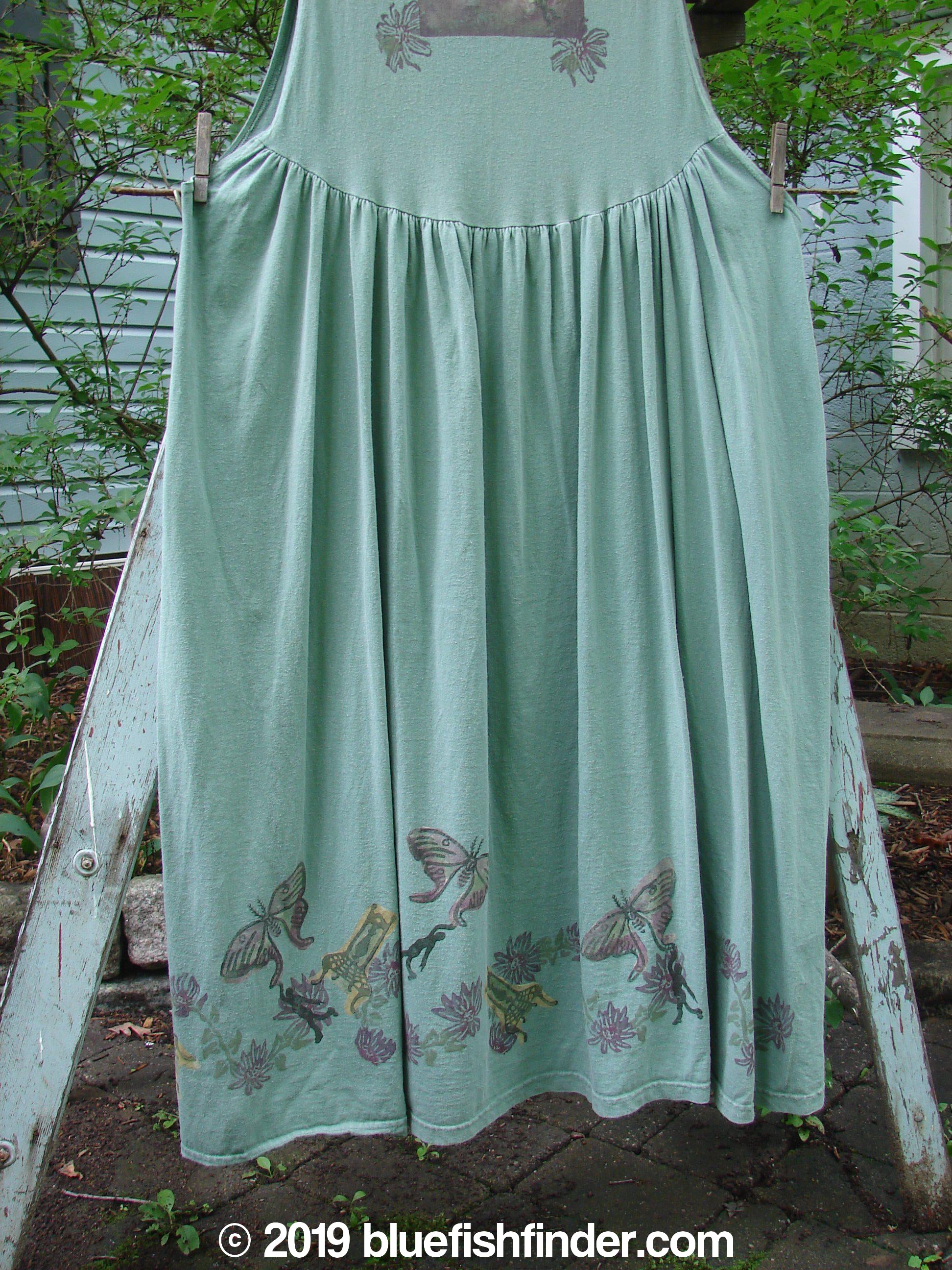 1994 Side Button Jumper Butterfly Garden River Size 1: A skirt with butterflies on it, hanging on a clothesline.