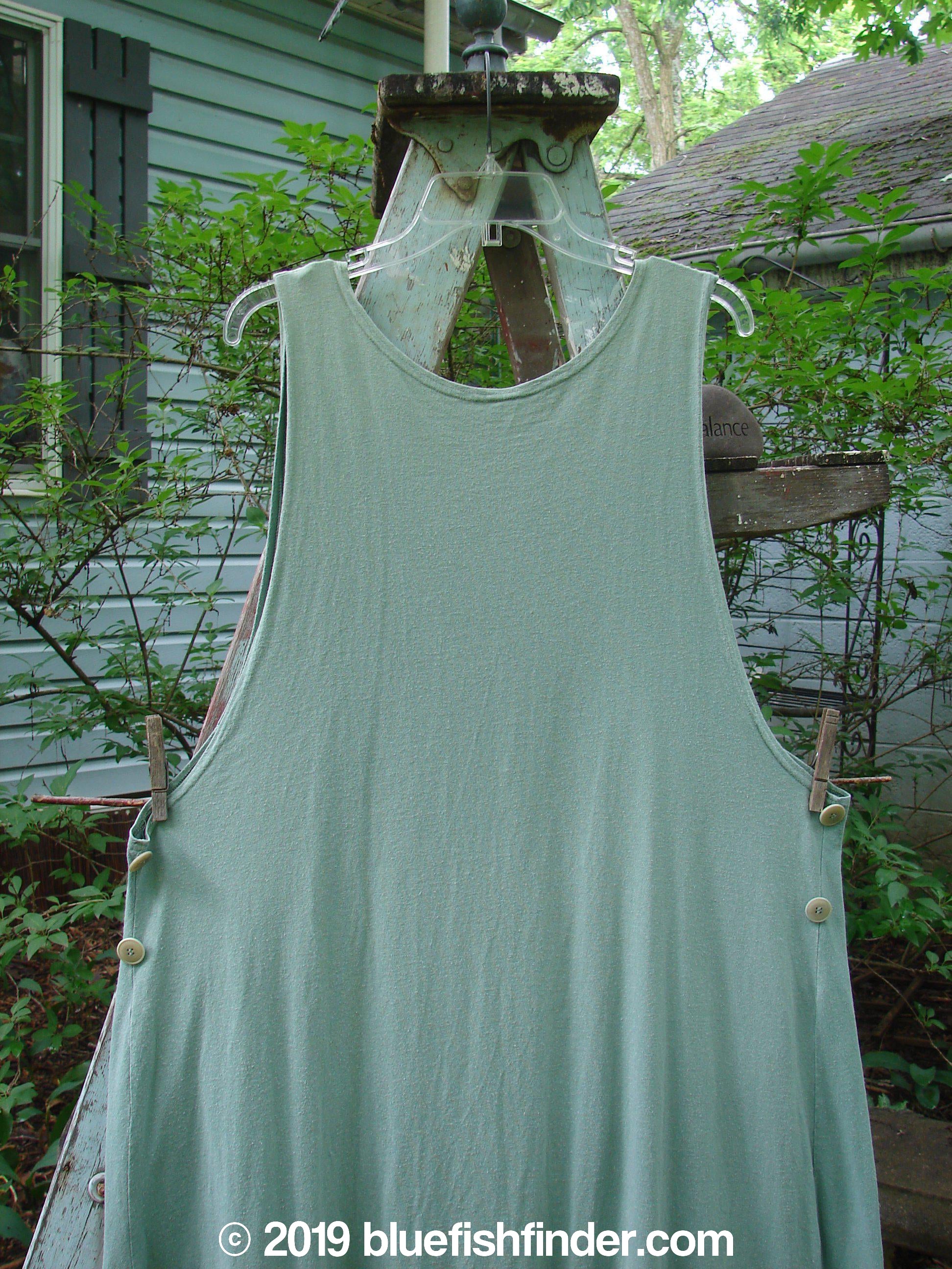 1994 Side Button Jumper Butterfly Garden River Size 1: A green shirt on a clothesline, part of the Spring Collection.