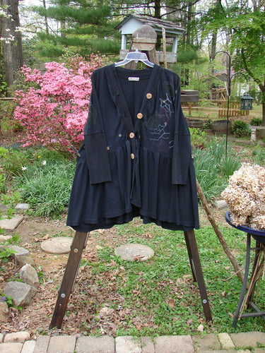 Image alt text: Barclay Thermal Bungalow Jacket with deep V neckline, wooden buttons, sweeping flounce, and modern graphics. One size fits all.