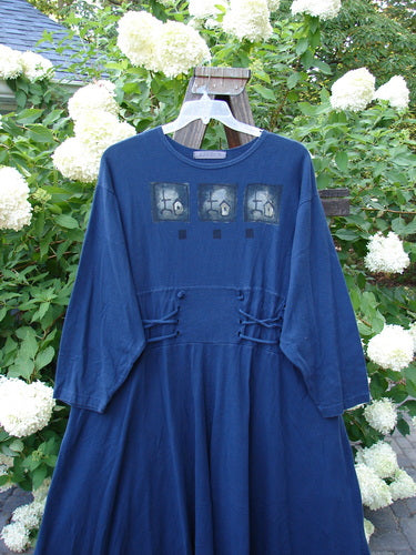 1997 Caryatid Dress Quad Art Window Pane Size 2: A vintage blue dress with a design. Features adjustable laces, drop shoulders, and a sweeping A-line lower. Made from organic cotton.