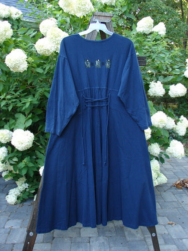 1997 Caryatid Dress Quad Art Window Pane Size 2: A vintage blue dress with adjustable laces in the front and back. Made from organic cotton, it features a wide A-line lower, drop shoulders, and a quad art theme paint. Bust: 52-60, Waist: 52-60, Hips: 62-70, Length: 56 inches.