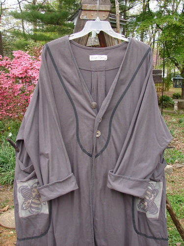 1998 Tiddly Winks Jacket Madeira Butterfly Size 2: A grey robe with buttons on a clothes rack.