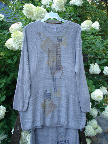 1995 Cotton Rayon Linear Column Sweater Duo Pike Dusk Mélange OSFA Size 1: Grey sweater with graphic design, ribbed neckline, lower sleeve accents, and dippy hemline. Matching column skirt with elastic waistline and ribbed hemline.