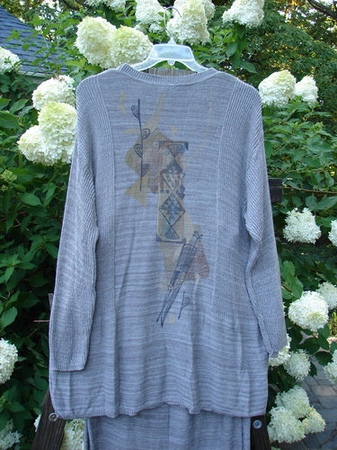 1995 Cotton Rayon Linear Column Sweater Duo Pike Dusk Mélange OSFA Size 1: A grey sweater with a design on it, featuring variegated yarns, contrasting stitchery, ribbed neckline, and lower sleeve accents.