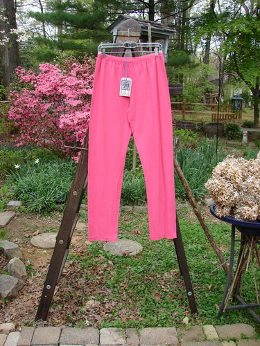 Barclay NWT Cotton Lycra Bally Layering Pant Legging Unpainted Flamingo Size 2: A close-up of a pink pants on a rack, perfect for layering.