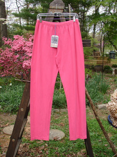 Barclay NWT Cotton Lycra Bally Layering Pant Legging Unpainted Flamingo Size 2: A pink pants on a clothes rack, perfect for layering.