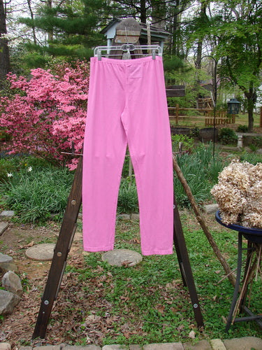 Barclay NWT Cotton Lycra Bally Layering Pant Legging Unpainted Peony Size 2: A pink pants on a rack, perfect for layering.