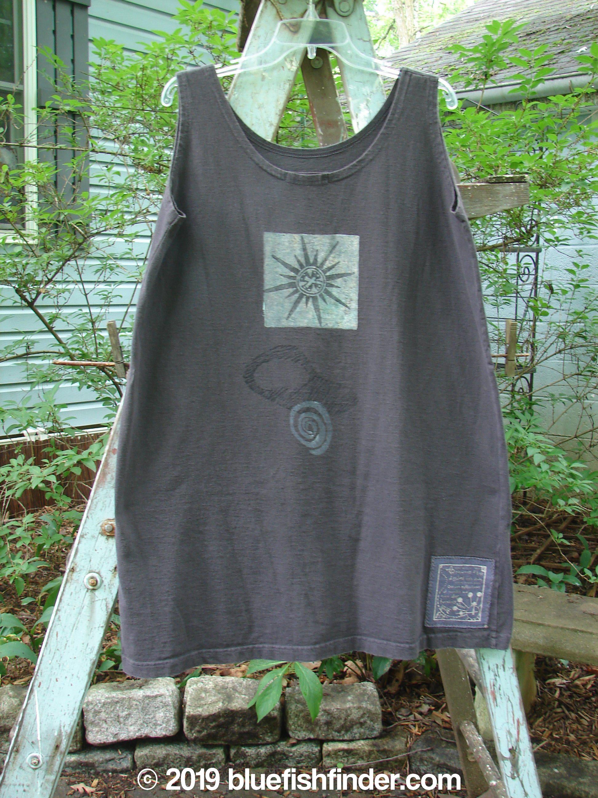 Image alt text: "1995 Sun Glint Tank with Blue Fish Patch on a wooden ladder, perfect condition, organic cotton"
