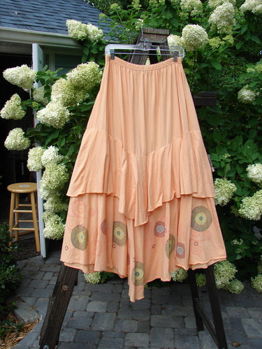Barclay Two Story Skirt Bubbles Sherbert Size 2: A peach skirt with sweet flutter-like edges and a large lower sweep. Made from organic cotton.