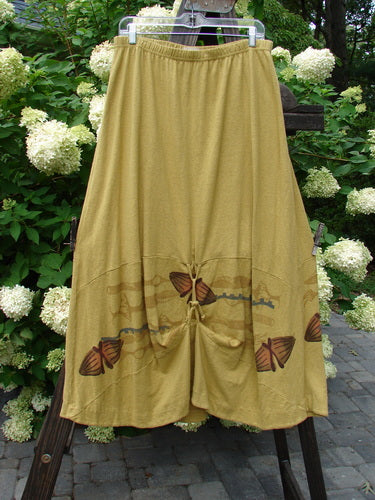 2000 Cotton Hemp Shade Skirt Bio Cell Gold Size 2: A yellow skirt with butterflies on it, featuring a full elastic waistband, varying hemline, and creative adjustments. Perfect for a resort getaway.