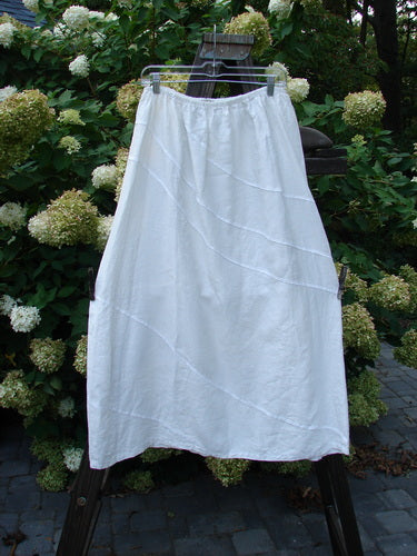 Barclay Linen Diagonal Skirt, a white skirt on a rack. Perfect for building a special look. Size 2.