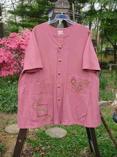 2000 Double Decker Pocket Top Garden Bug Rose Size 2: A pink shirt with oversized pockets stacked on top of each other. Super flattering with pleated back line and tab. Signature Blue Fish Patch and Garden Bug Theme Paint.