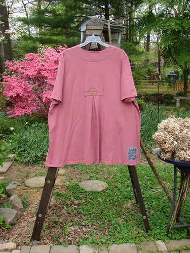 2000 Double Decker Pocket Top Garden Bug Rose Size 2: A swingy pink shirt with oversized front pockets stacked on top of each other.