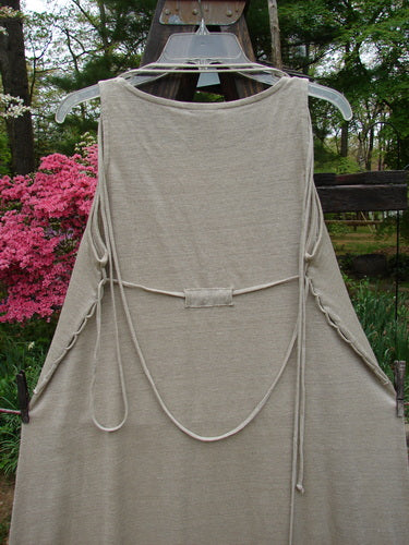 1998 Linen Knit Wrap Dress Unpainted Natural Size 1: A dress on a swinger with an amazing drape and lower flair. Straight bodice, slender and elegant.