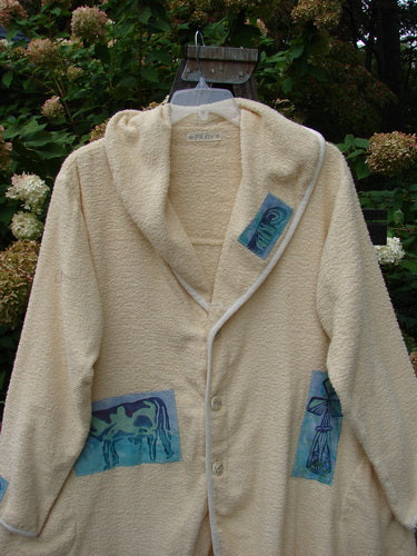 1996 Patched Cape Cod Coat with farm-themed patches and a deep V-neck collar, made from cozy French Cotton Terry Cloth.