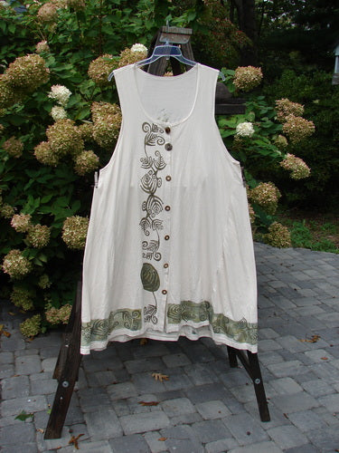 1993 Long Column Vest Feather Fern Tea Dye OSFA: A white dress on a rack with green design, featuring wooden-like front vintage buttons.