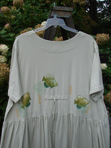 1999 Carry All Dress Goldfish Dust Size 2: A white shirt with fish on it. Features 8 original blue fish buttons and a goldfish theme paint.