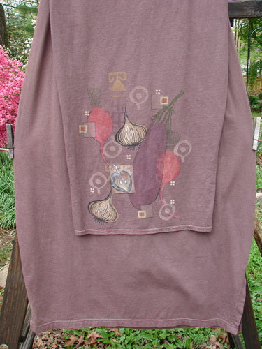 Barclay Button Panel Skirt Vegetable Sepia Size 2: A purple t-shirt with vegetables on it, featuring a close-up of a cloth.