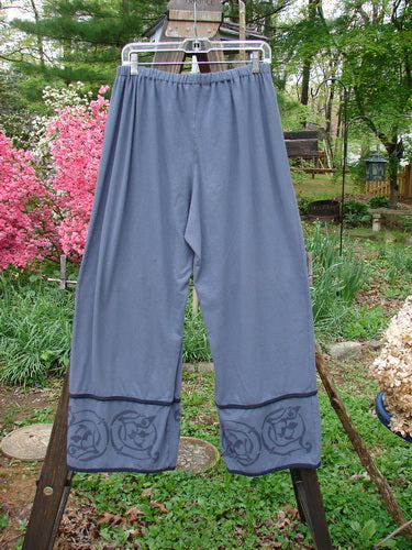 Image alt text: Barclay Cotton Lycra Tic Tac Toe Pant in Blue Dusk, size 2, on a clothes rack. Slenderizing fall with contrasting lettuce lower edgings and a snappy lower flair.