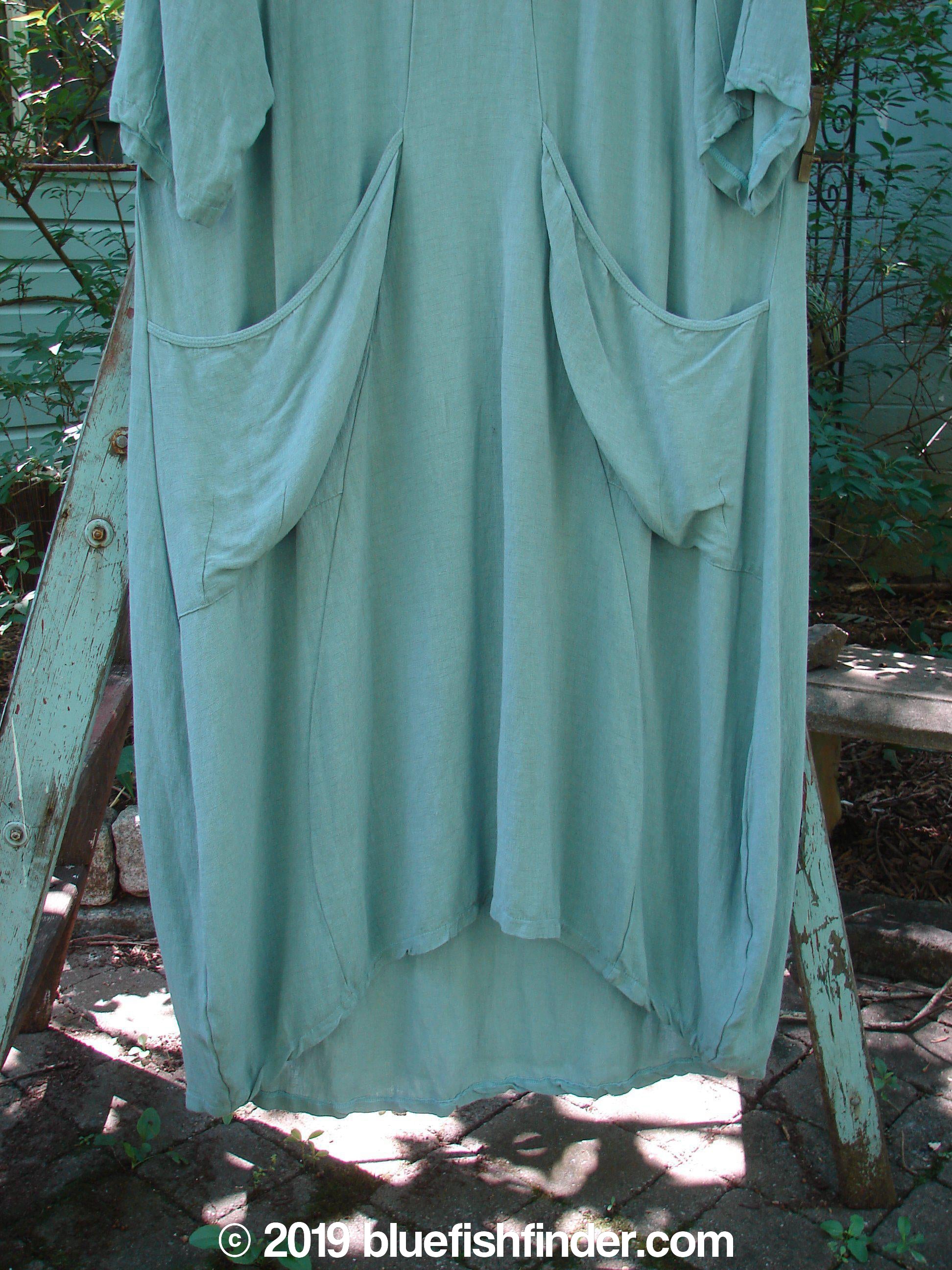 Barclay NWT Rayon Thostle Dress Unpainted Dusty Blue Size 1: A blue dress with a wide neckline, hourglass shape, and drop front pockets.