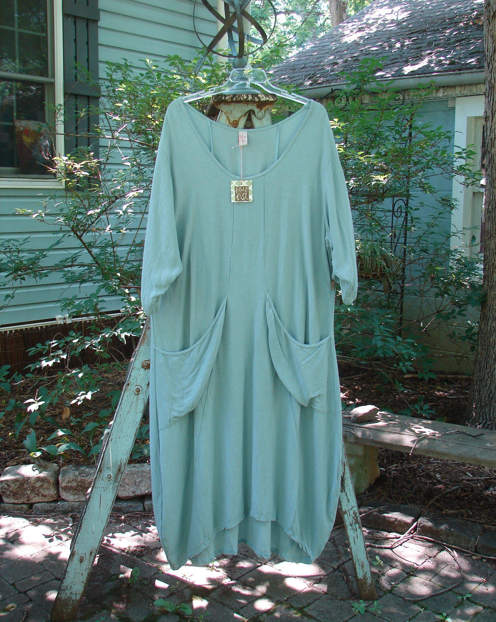 Barclay NWT Rayon Thostle Dress, unpainted dusty blue, size 1. Wide scoop neckline, hourglass shape, pegged hemline, drop front pockets.