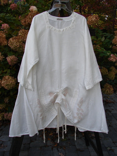 A white Barclay Linen Venetian High Vent Tunic Dress with a feminine hourglass shape, wider hip and hemline, and softly rolled neckline. Size 2.