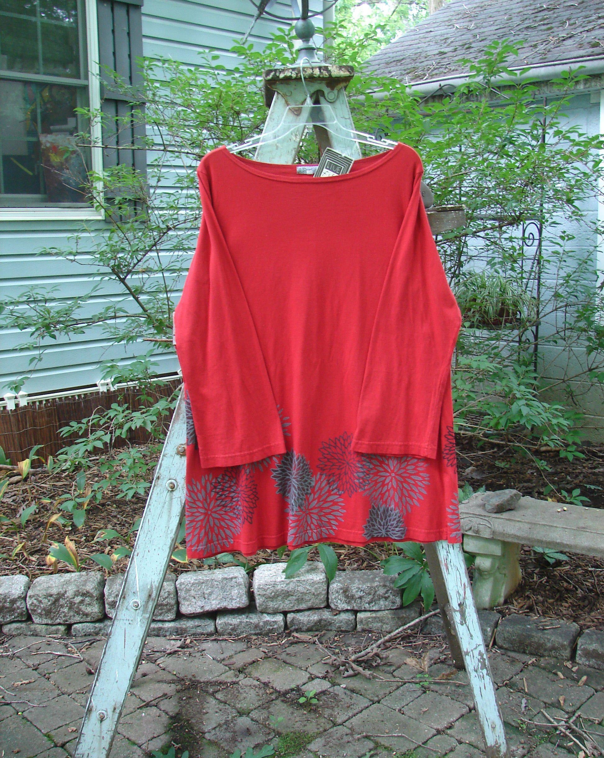 Barclay NWT Reverie Top Chrysanthemum Ruby Size 1: A red shirt with a chrysanthemum pattern on a clothes line.