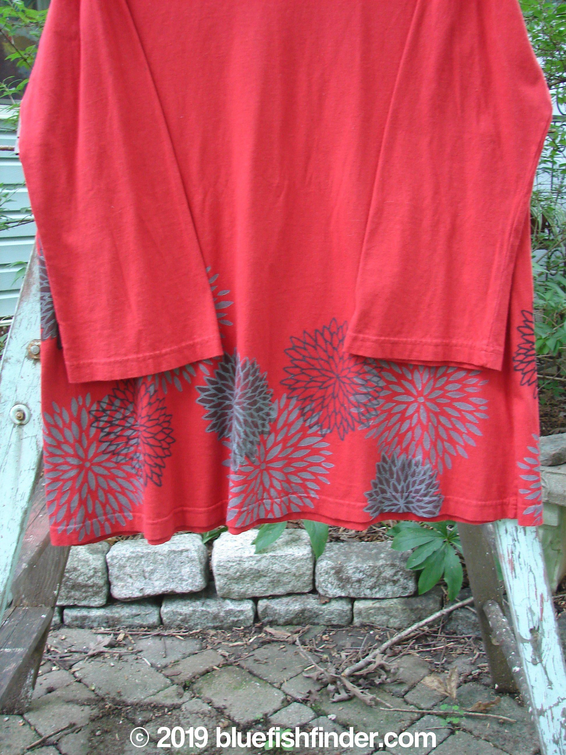 Barclay NWT Reverie Top: A red shirt with grey flowers on it. Sweet boat neckline, drop shoulders, chrysanthemum theme paint. A-line shape, made from organic cotton. Size 1.
