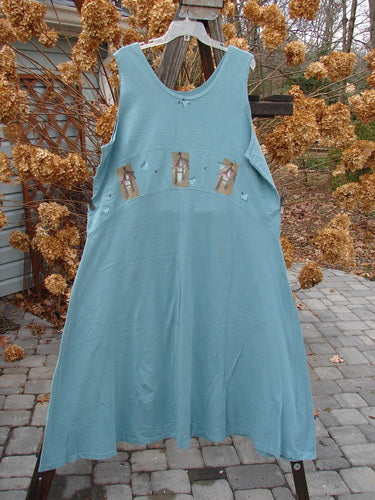 1995 Zelda Jumper Dress with Triple Pagoda design. A blue dress on a clothesline. Medium weight eco cotton. Versatile and easy everyday jumper. Bust 48, Waist 50, Hips 58, Hem Circumference 105, Length 55 inches. From Bluefishfinder.com, the legendary, magical clothing line by Jennifer Barclay.