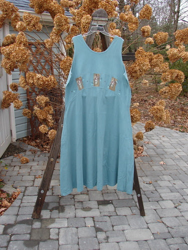 1995 Zelda Jumper Dress Triple Pagoda Venus Size 2: A blue dress with a yoked waist seam, deeper scooped neckline, and A-line shape. Features a pagoda theme painted front and back. Versatile and easy to wear.