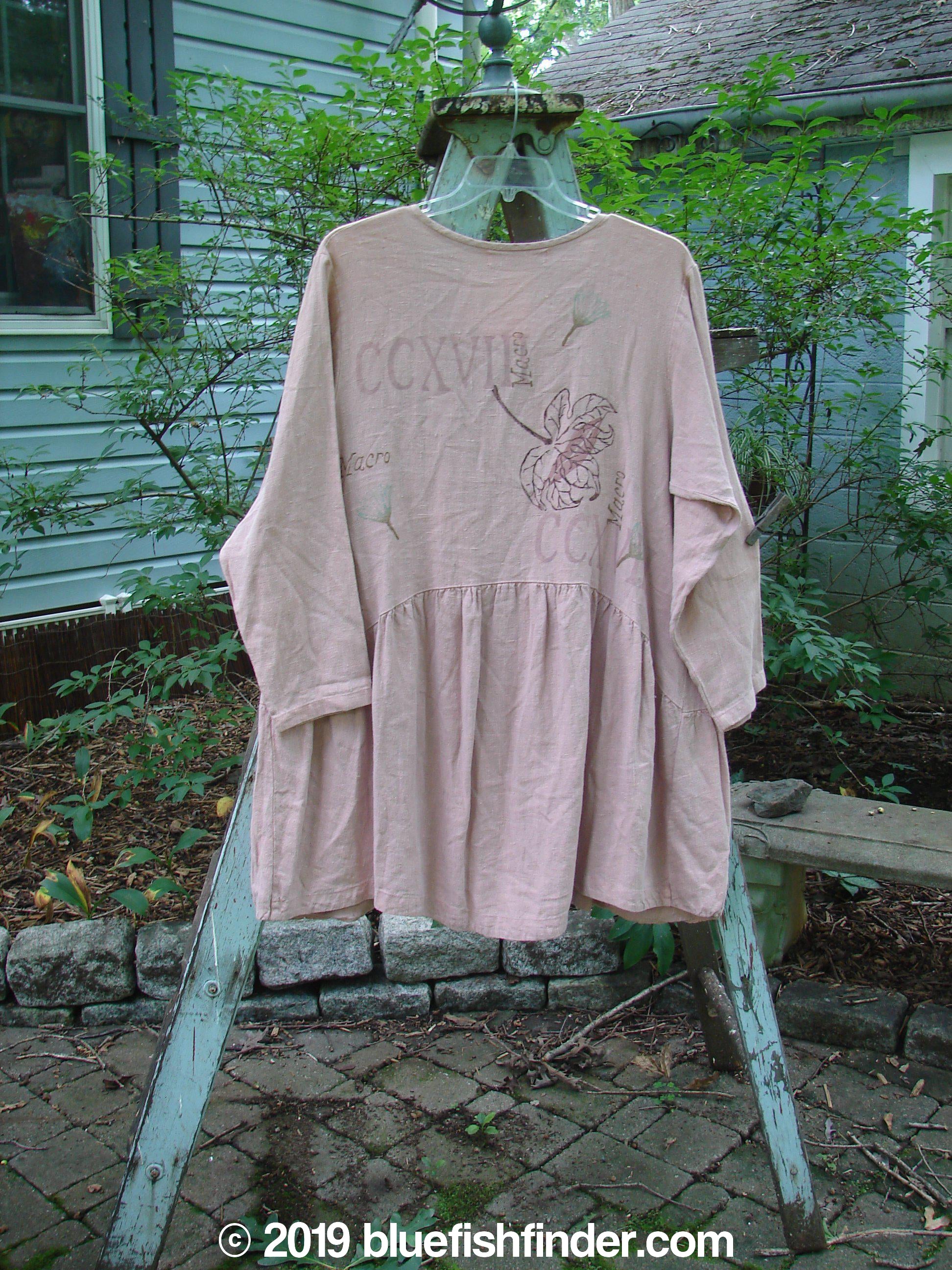 1998 Botanicals Meadow Jacket Macro Mallow Size 1: A pink shirt with a flower design on a clothes rack.