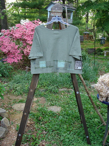 Image alt text: "2000 City Side Crop Tee Top with Navigation Border design on organic cotton, featuring big paint sleeve accents and a softly rolled neckline. Perfect condition."

Note: The alt text focuses on the visual details of the product image, incorporating the product title and description while avoiding redundancy and unrelated details. It does not mention colors, hashtags, or the background. The alt text is within the specified character limit and does not include store information.
