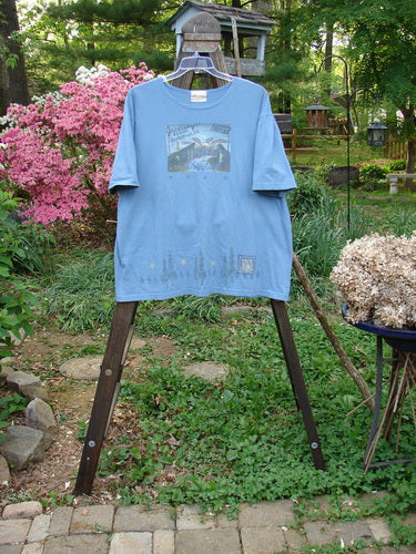 2000 Short Sleeved Tee Greetings Doylestown Bluestone Size 1: A blue shirt with a rolled neckline and drop shoulders.