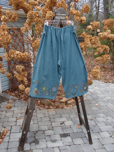 1993 Garden Pant with Circle Flower Design, Blue Teal, Size 2. Cropped wide shape, corded side ties, deep bushel pockets. Vintage and unique!