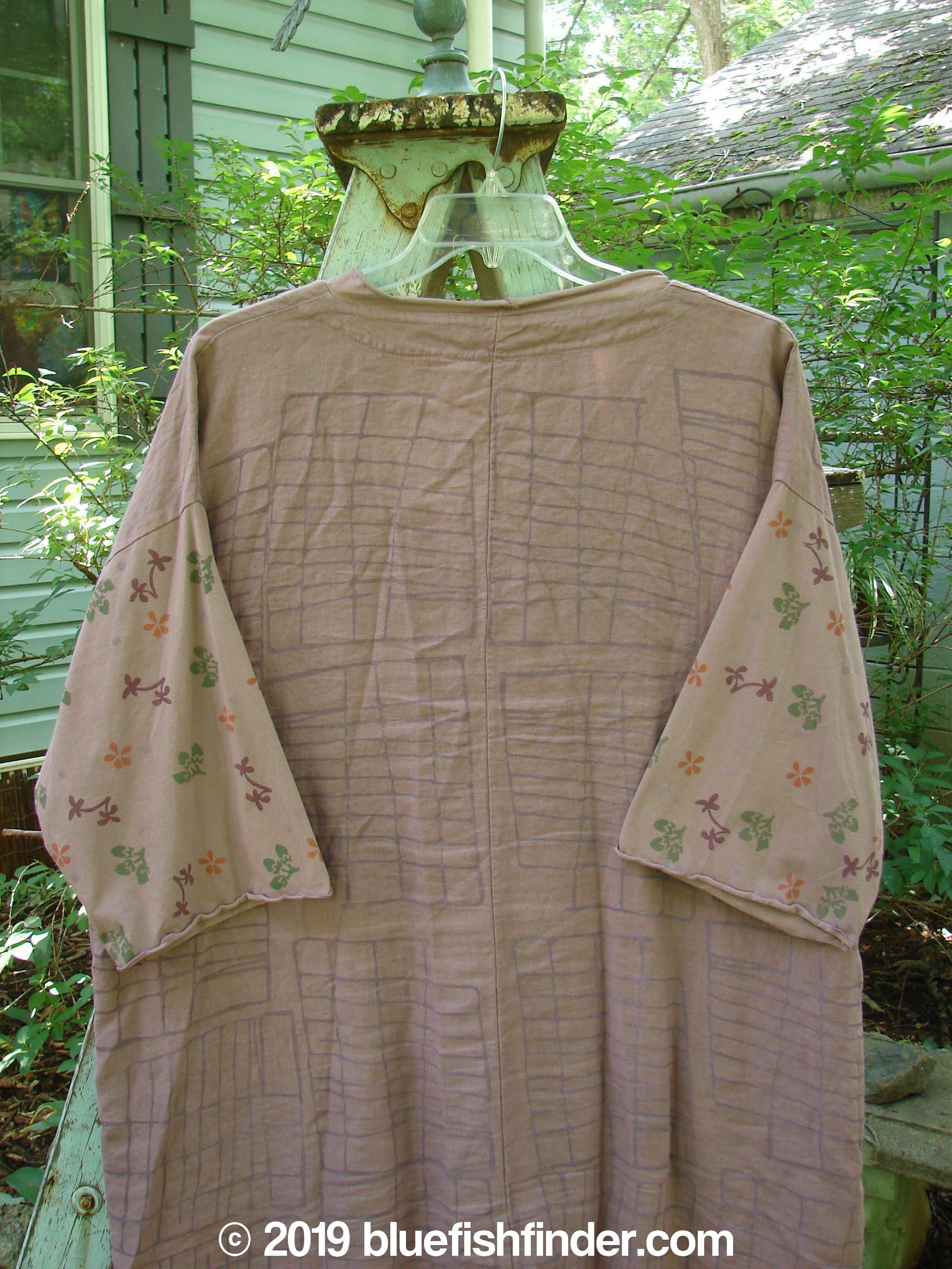 Image alt text: Barclay Linen Cotton Sleeve Pocket Cardigan in Rich Mauve, featuring a patterned shirt with wooden button curved front, drop shoulders, and organic cotton sleeves painted in a floral theme.