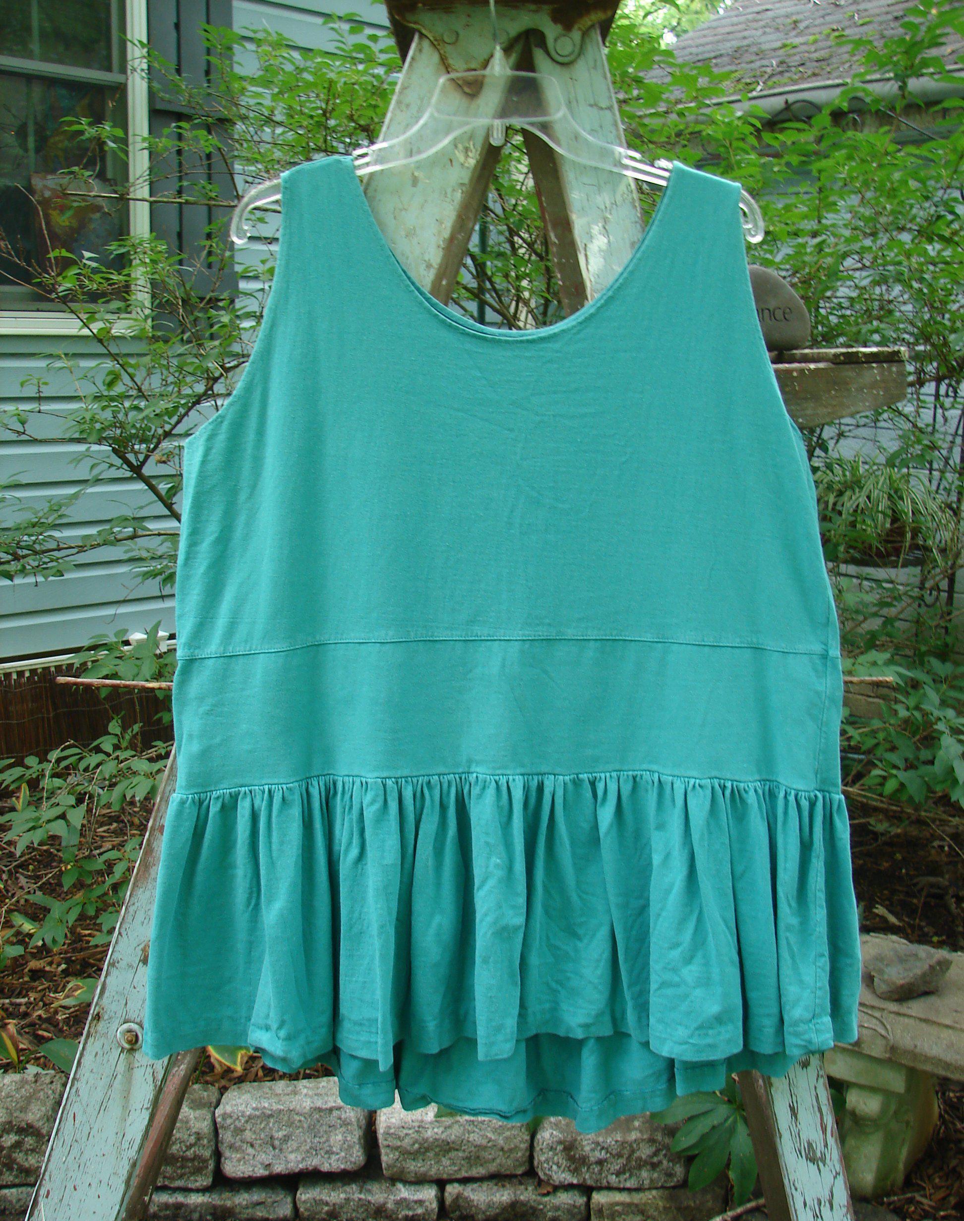 A vintage 1990 Button Tier Top in Turq, featuring a gathered flounce, drop waistband, and ruffled hemline. OSFA.