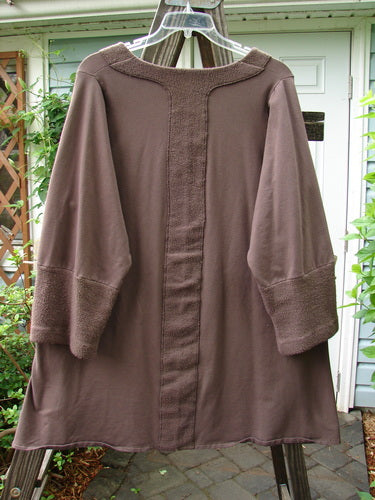 A brown cotton lycra tunic top with Celtic Moss accents, featuring a single side front pocket and A-line shape. Size 1.
