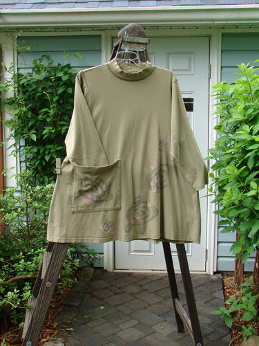 1996 Ramble Dress Follow Path Bottlecap Size 1: Long-sleeved shirt on a swinger, with ribbed mock T neck, oversized front pocket, and exterior stitching.