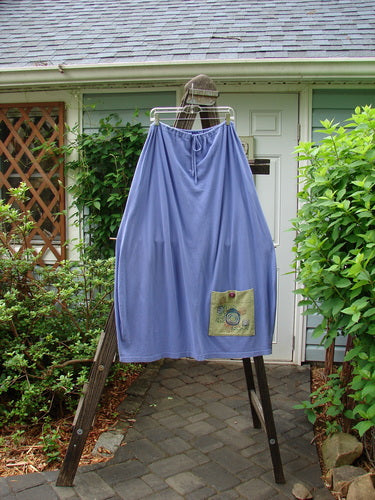 1997 Big Pocket Skirt Bolder Skylark Size 1: A blue skirt with a unique bell-shaped bottom and a super giant lower exterior pocket. Features a drawstring waistline, deep side pockets, and bolder theme paint. Length is 39 inches.