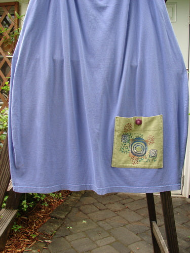 1997 Big Pocket Skirt Bolder Skylark Size 1: A medium-weight organic cotton skirt with a drawstring waistline, bell-shaped bottom, and a super giant lower exterior pocket. Features a vintage Blue Fish button closure and two deep side pockets. Length: 39 inches.