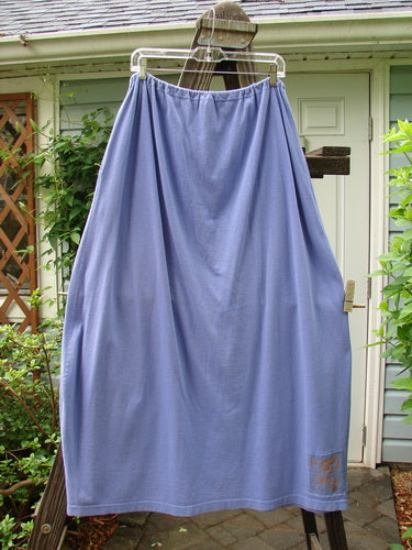 1997 Big Pocket Skirt Bolder Skylark Size 1: A blue skirt with a bell-shaped bottom, drawstring waistline, and a super giant exterior pocket with a vintage blue fish button closure.