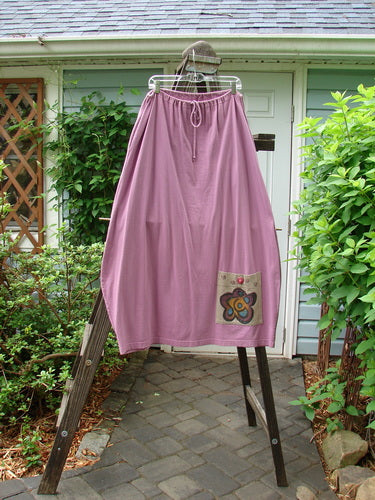 1997 Big Pocket Skirt with Single Flower Crocus design. Medium weight organic cotton. Drawstring waistline, bell-shaped bottom, and super giant exterior pocket. Waist 26-52, hips 52, length 39 inches.